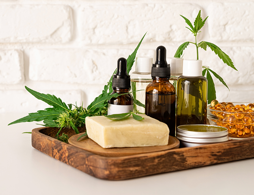 A photo of CBD oil and cannabis leaves cosmetics with cosmetics