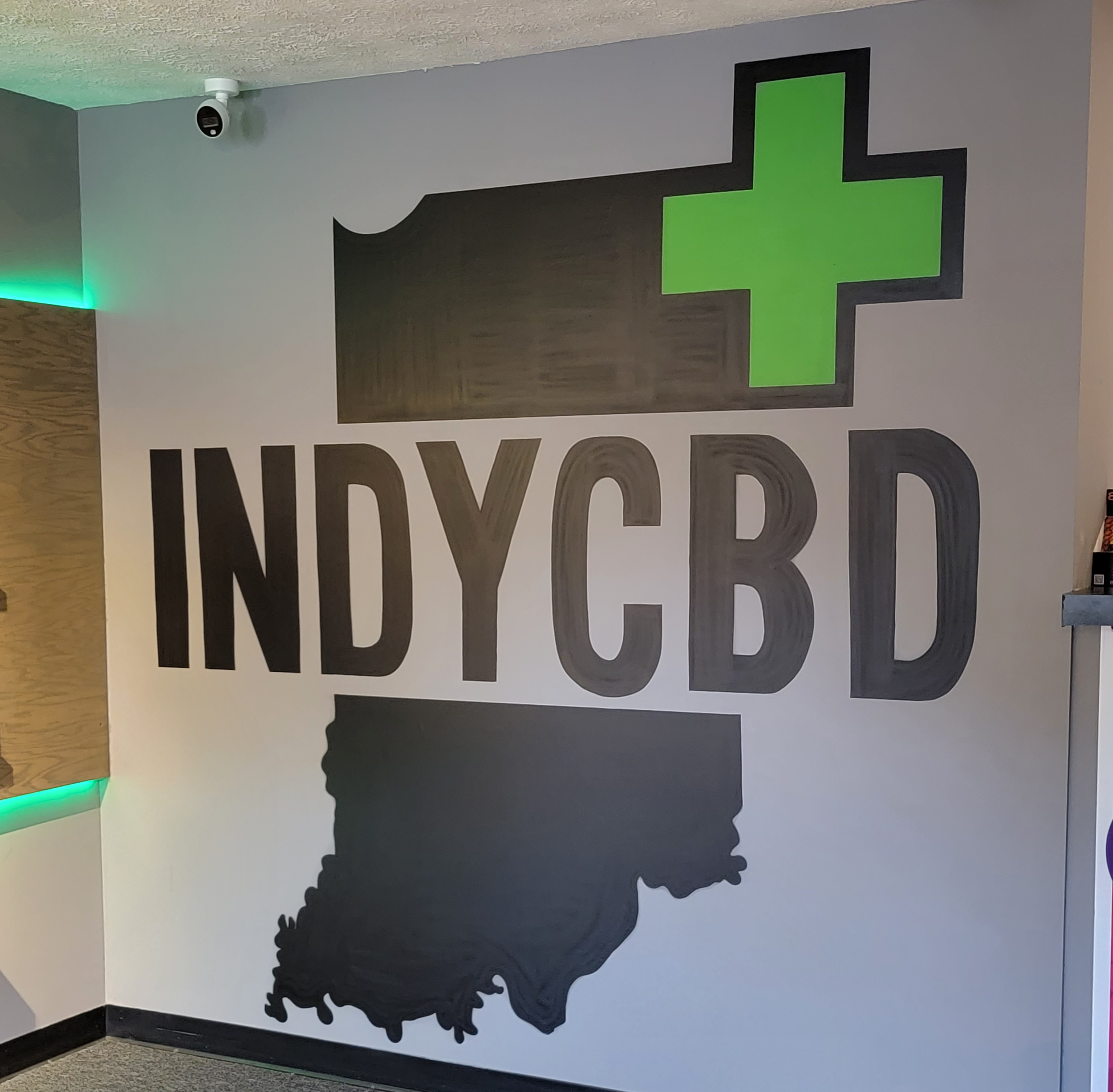 A photo of the Indy CBD Plus logo inside the store